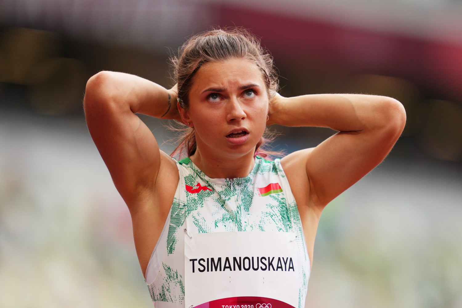 Tokyo 2020 Olympics - Athletics - Women&#039;s 100m - Round 1 - OLS - Olympic Stadium, Tokyo, Japan - July 30, 2021. Krystsina Tsimanouskaya of Belarus reacts after competing in Heat 6 REUTERS/Aleksandra Szmigiel