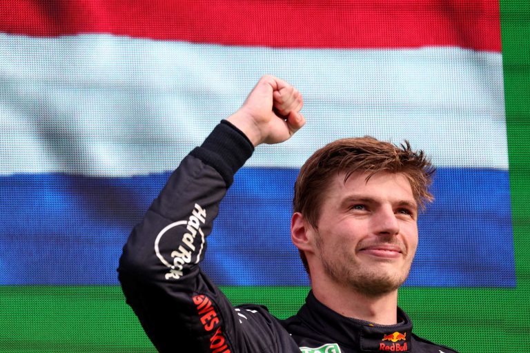 Red Bull Racing&#039;s Dutch driver Max Verstappen celebrates on the podium after winning the Dutch Formula One Grand Prix at the Zandvoort circuit on September 4, 2022. (Photo by Kenzo TRIBOUILLARD / AFP)