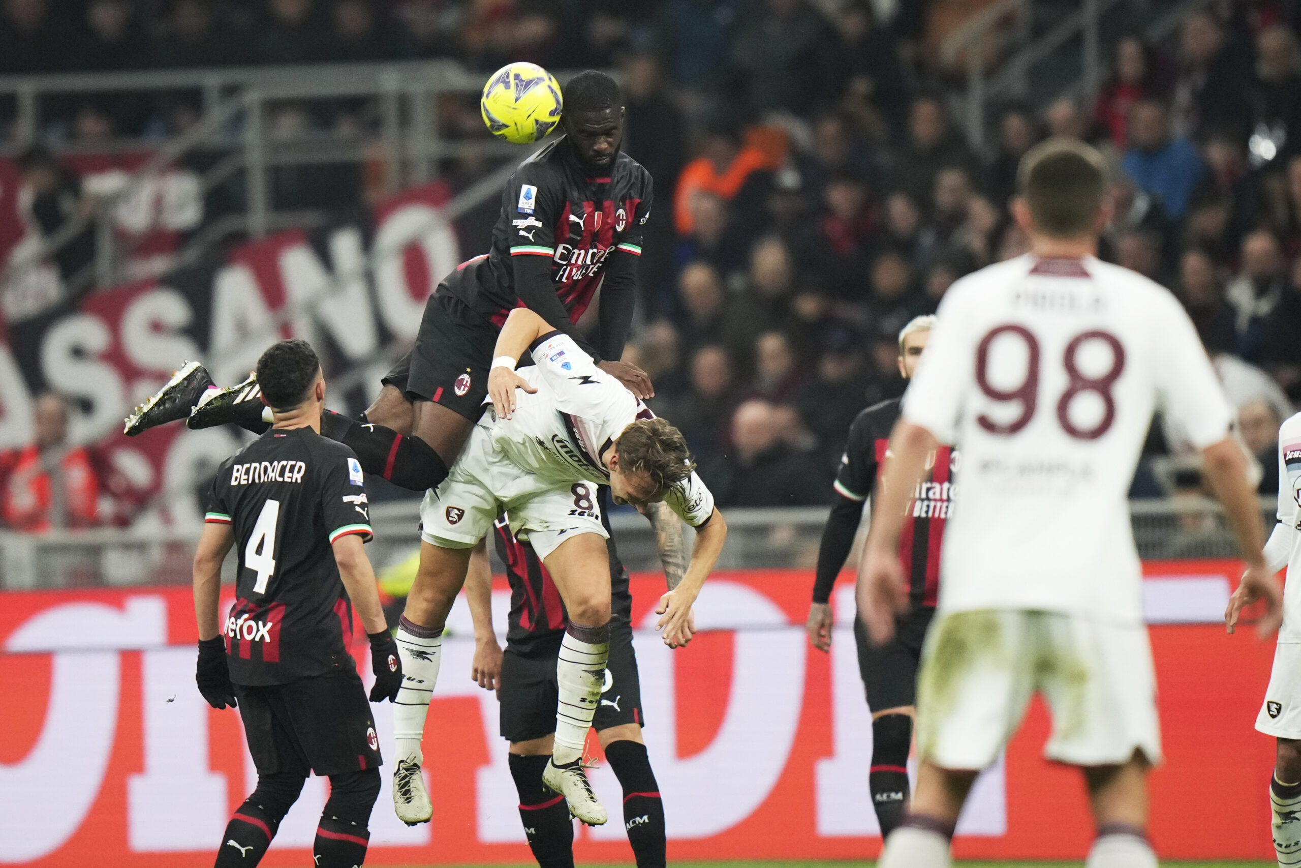 AC Milan&#039;s Fikayo Tomori, top and Salernitana&#039;s Emil Bohinen challenge for the ball during a Serie A soccer match between AC Milan and Salernitana at the San Siro stadium in Milan, Italy, Monday, March 13, 2023. (AP Photo/Luca Bruno)