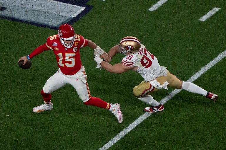 Feb 11, 2024; Las Vegas, Nevada, USA;  Kansas City Chiefs quarterback Patrick Mahomes (15) runs away from San Francisco 49ers defensive end Nick Bosa (97) during the fourth quarter at Allegiant Stadium during Super Bowl LVIII. The Chiefs defeated the 49ers 25-22 in overtime. (Stan Szeto / Image of Sport/Sipa USA)
2024.02.11 Las Vegas
futbol amerykanski , amerykanska liga futbolu NFL
Super Bowl LVIII
Foto Stan Szeto/Image of Sport/SIPA USA/PressFocus

!!! POLAND ONLY !!!