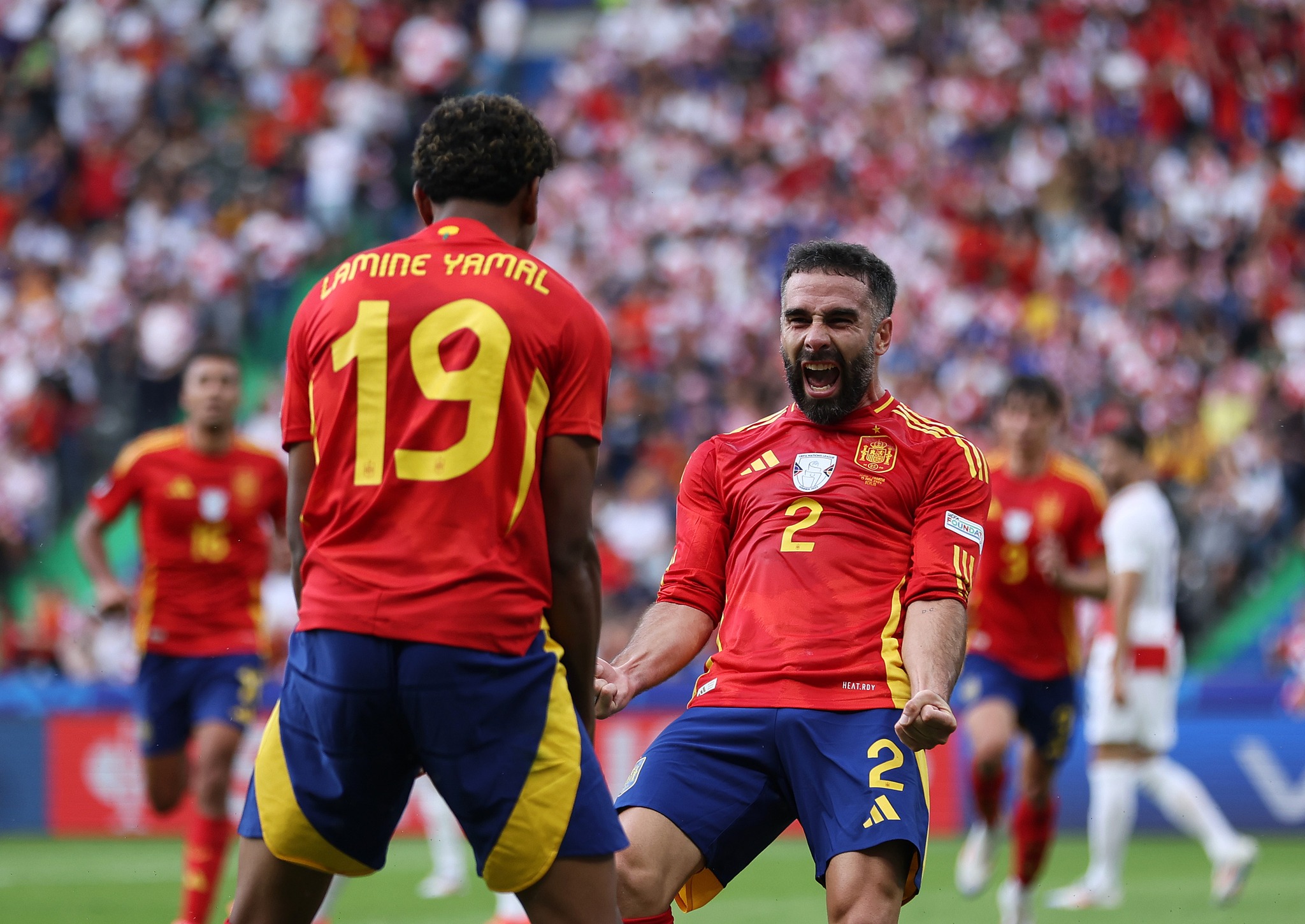 BERLIN, GERMANY - JUNE 15: Daniel Carvajal of Spain celebrates scoring his team&#039;s third goal with teammate Lamine Yamal during the UEFA EURO 2024 group stage match between Spain and Croatia at Olympiastadion on June 15, 2024 in Berlin, Germany. (Photo by Maja Hitij - UEFA/UEFA via Getty Images)