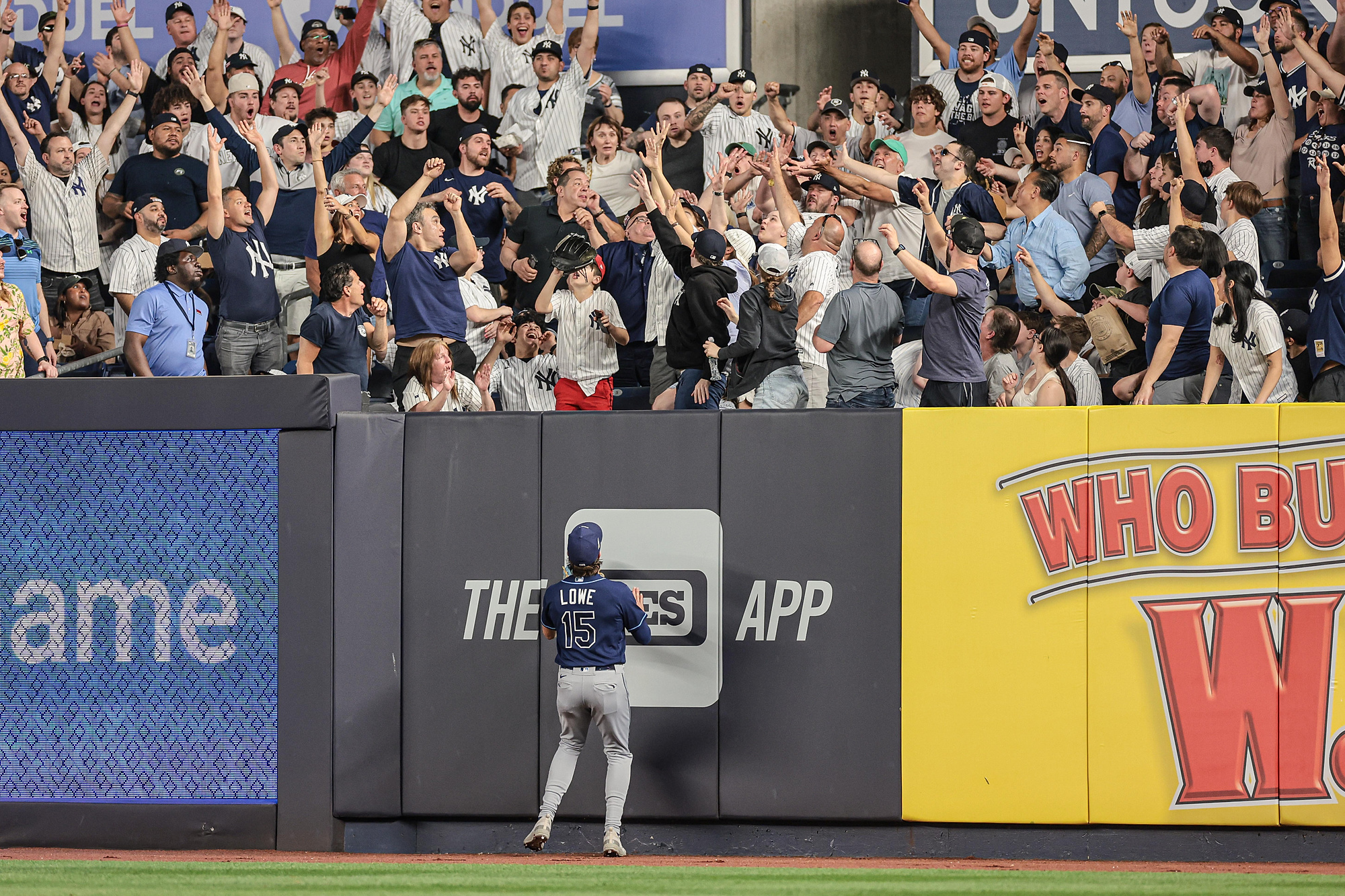 May 12, 2023; Bronx, New York, USA; Fans reach for a solo home run hit by New York Yankees shortstop Anthony Volpe (not pictured) as Tampa Bay Rays right fielder Josh Lowe (15) looks up during the fifth inning - Yankee Stadium. Mandatory Credit: Vincent Carchietta-USA TODAY Sports/Sipa USA 

2023.05.12 Bronx
Baseball Liga MLB
MLB: Tampa Bay Rays - New York Yankees
Foto Vincent Carchietta-USA TODAY Sports/SIPA USA/PressFocus

!!! POLAND ONLY !!!