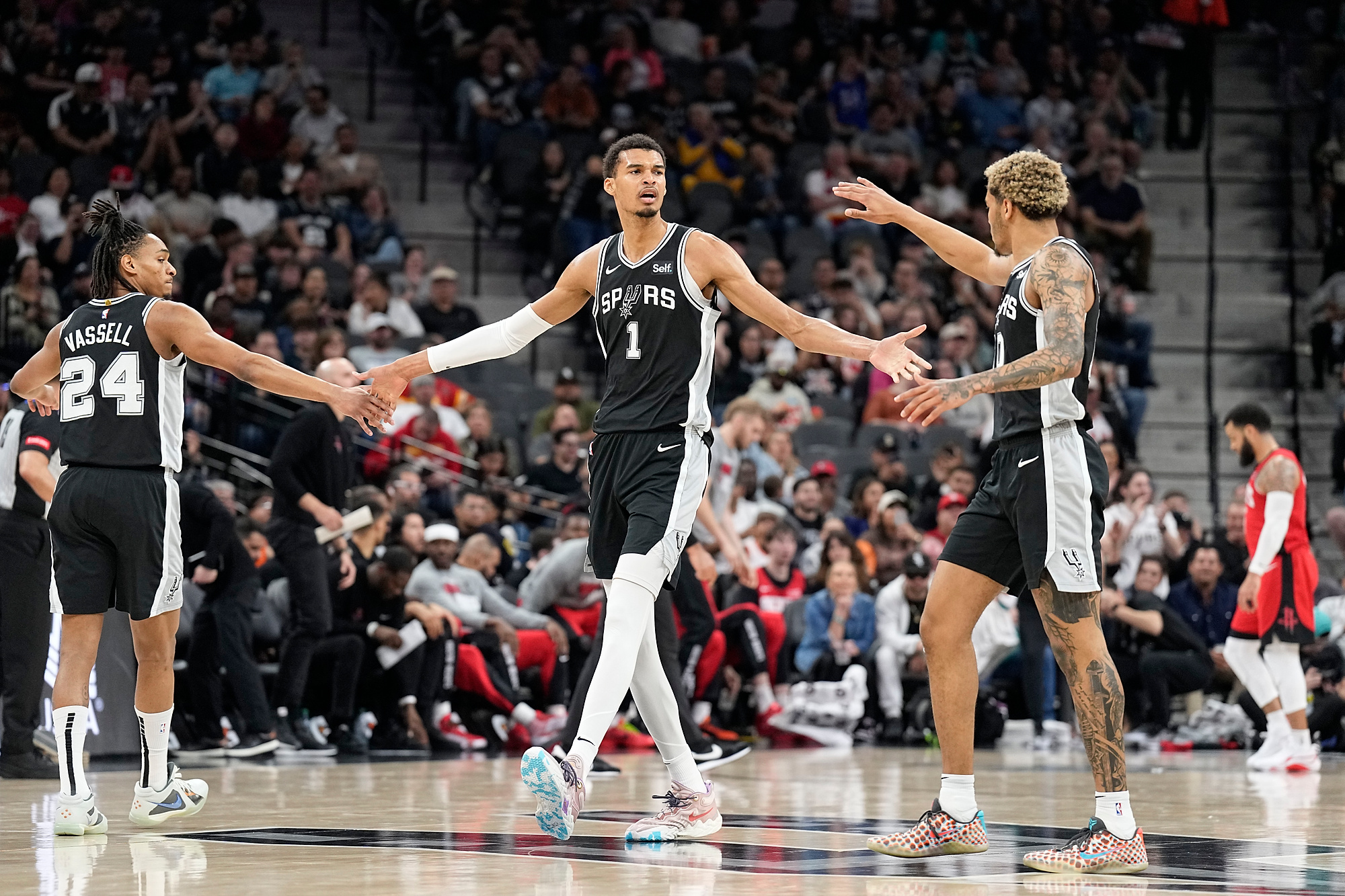 Mar 12, 2024; San Antonio, Texas, USA; San Antonio Spurs forward Victor Wembanyama (1) reacts with guard Devin Vassell (24) and forward Jeremy Sochan (10) before a time out during the first half against the Houston Rockets at Frost Bank Center. Mandatory Credit: Scott Wachter-USA TODAY Sports/Sipa USA
2024.03.12 San Antonio
koszykowka mezczyzn amerykanska liga koszykowki NBA 
NBA: Houston Rockets at San Antonio Spurs
Foto Scott Wachter-USA TODAY Sports/SIPA USA/PressFocus

!!! POLAND ONLY !!!